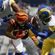 A couple of footballers from the Chicago Bears and LA Rams skirmish a bit on the field.
